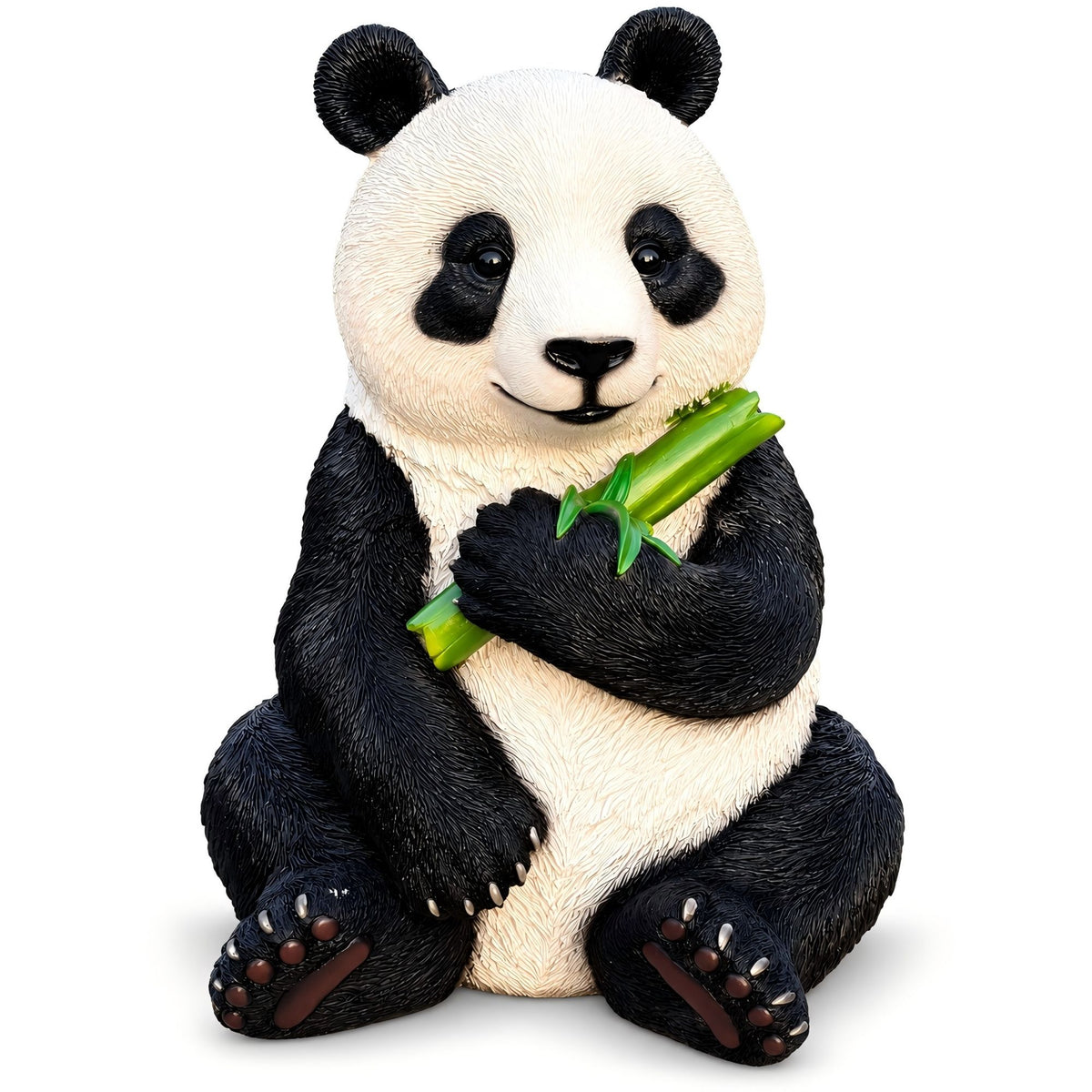Sitting black-and-white panda statue holding a green bamboo stalk