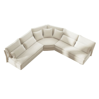 White L-shaped sectional sofa with curved corner, striped cushions, and 7 pillows