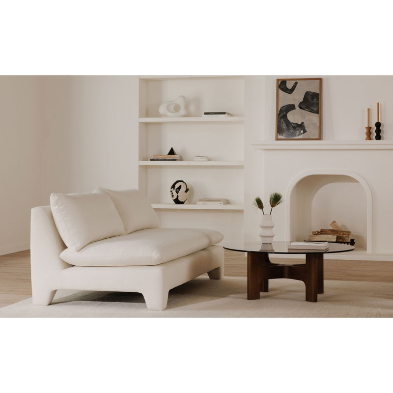 Round glass coffee table with dark brown pedestal-style wooden base