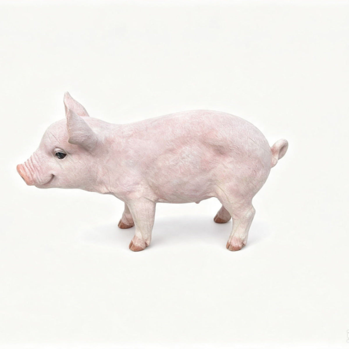 Baby pink pig garden statue figurine with lifelike details, standing side view.