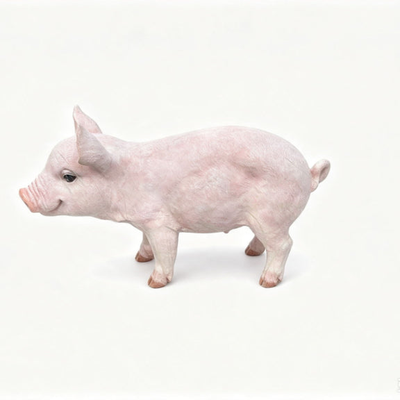 Baby pink pig garden statue figurine with lifelike details, standing side view.