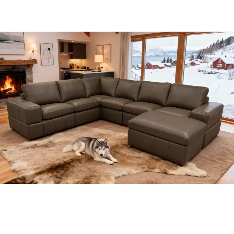 Dark green modular sectional sofa with square arms and chaise-style ottoman seating