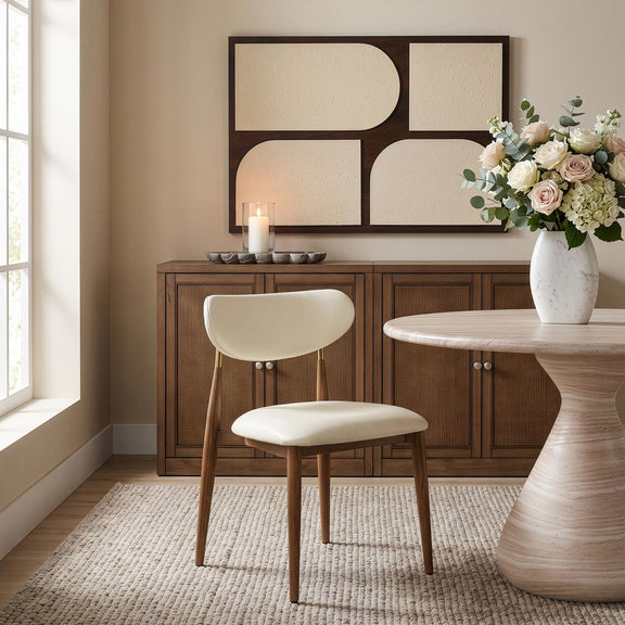 White vegan leather dining side chair with walnut legs and button details