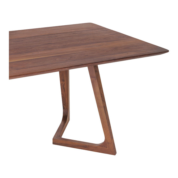 Walnut dining table with rectangular top and tapered pedestal legs with open frames