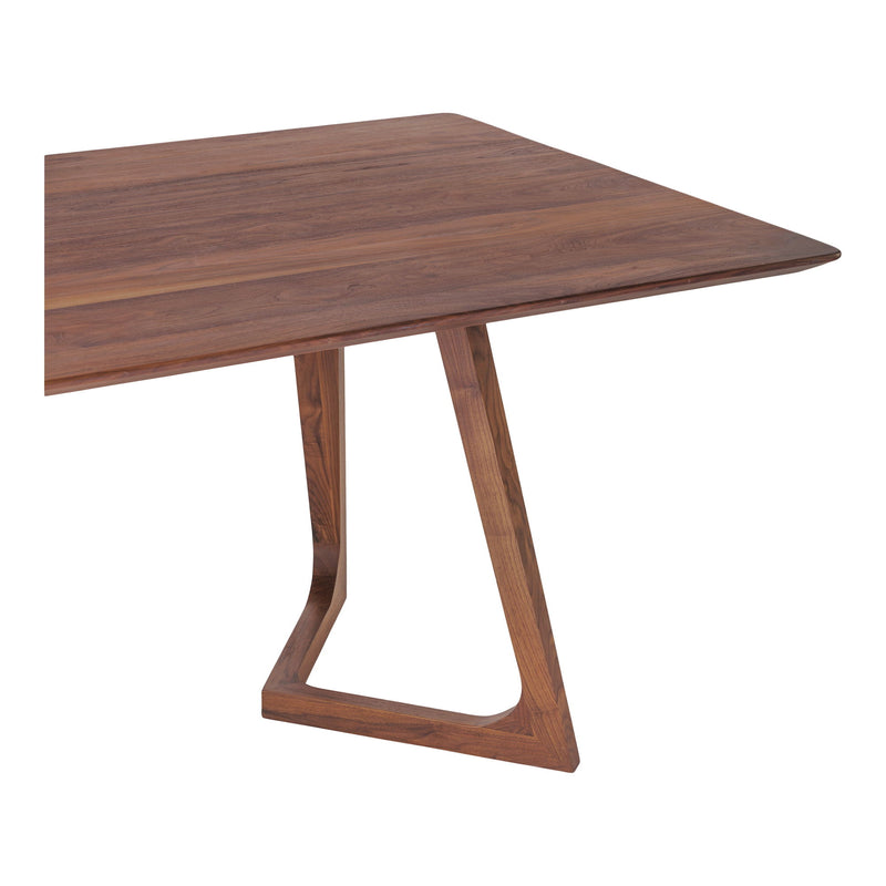 Walnut dining table with rectangular top and tapered pedestal legs with open frames