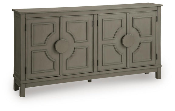 Warm gray accent cabinet with four panel doors and round center knobs