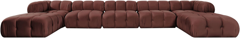 Dark red modular sectional sofa with tufted cushions and rounded ottoman sections