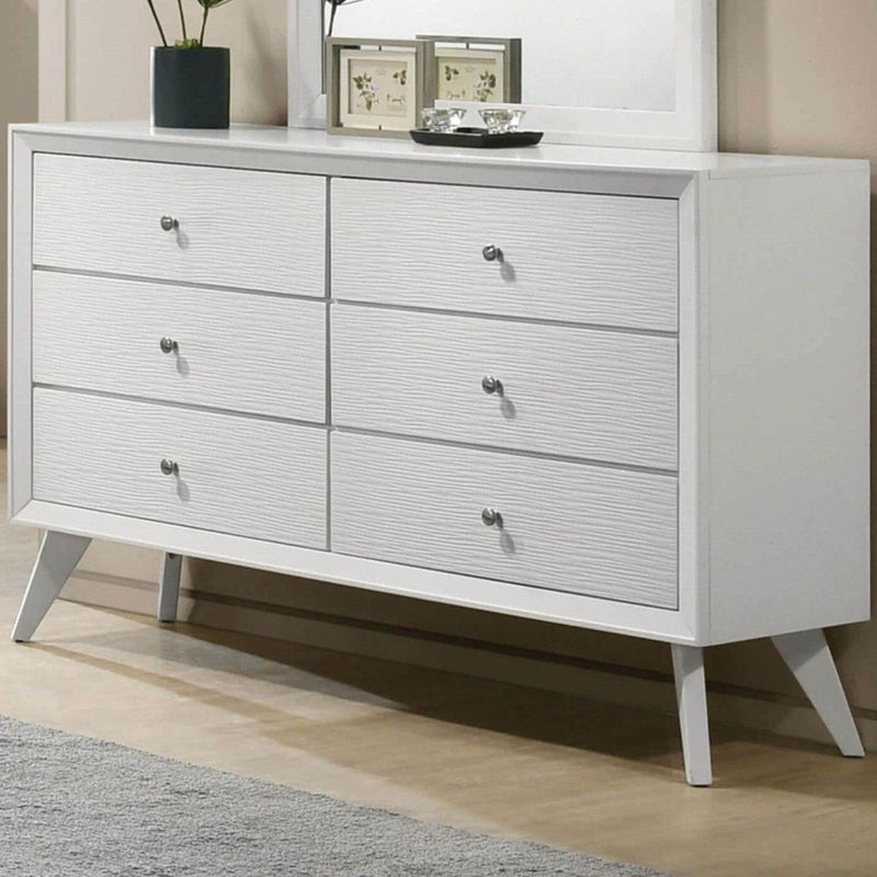 White dresser with mirror, angled legs, and round knobs on six drawers.
