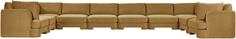 Beige velvet sectional sofa with cushioned arms and modular corner sections