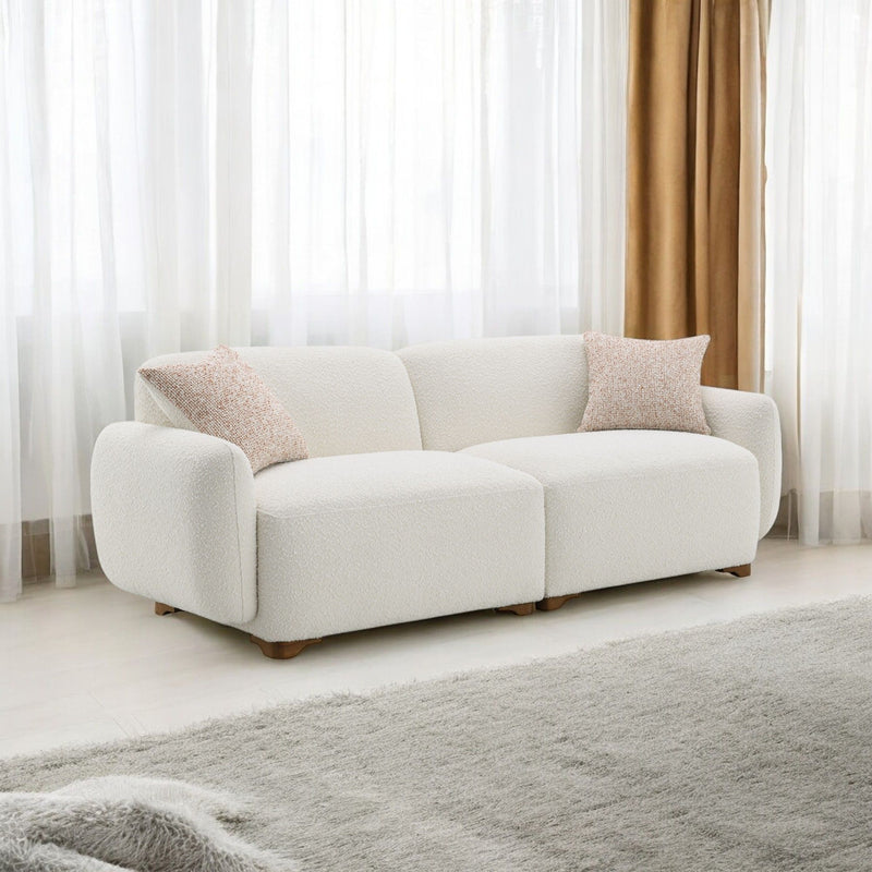 Darius beige boucle sofa with 2 toss pillows