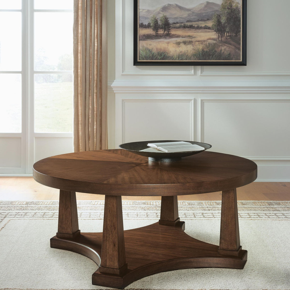 Round wooden end table with lower shelf and arched base
