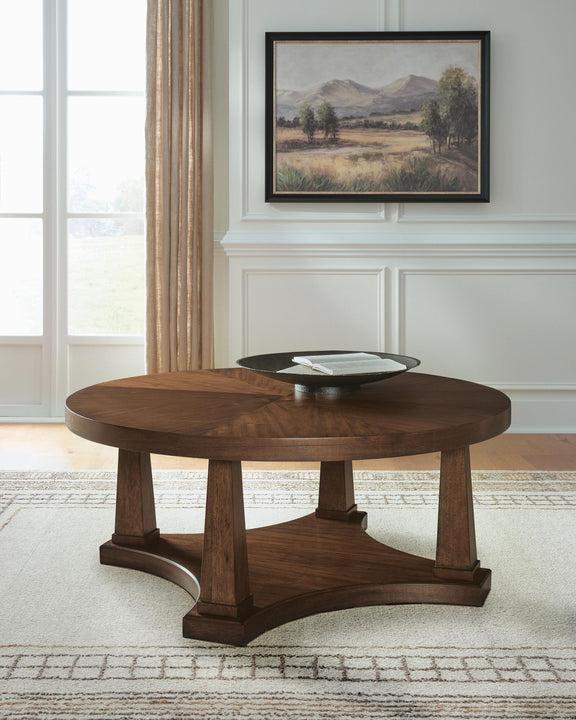 Round wooden end table with lower shelf and arched base