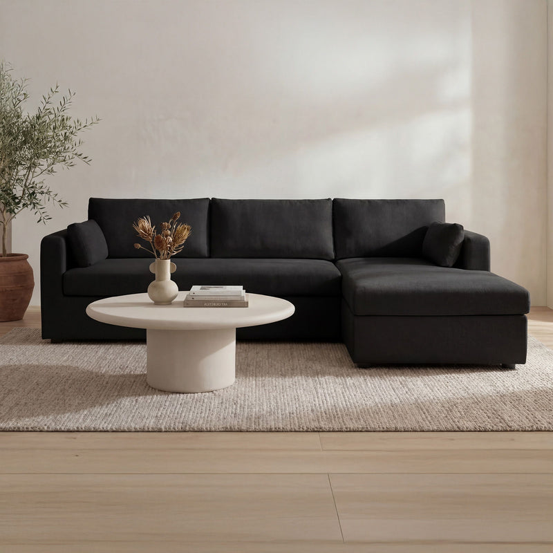 Burrow sectional sofa with right chaise in black fabric, low chaise ottoman