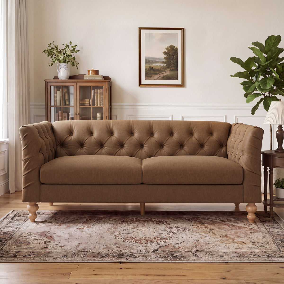Light brown chesterfield-style sofa with tufted back, flared arms, and wooden legs