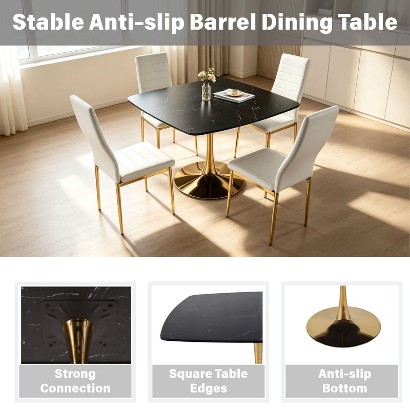 Black dining table with gold pedestal and four chairs in room