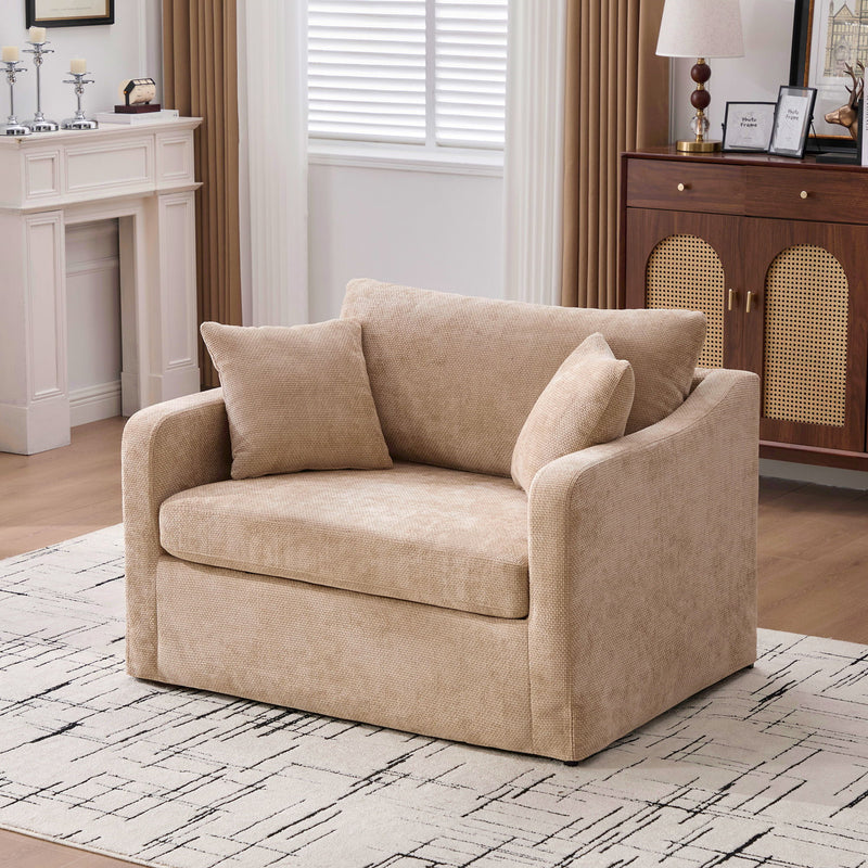 Tan fabric accent chair with 2 bolster pillows, rounded arms, comfortable seat