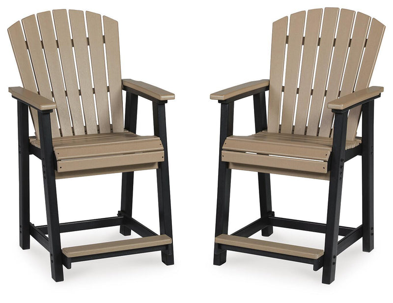 Pair of barstools with black legs, driftwood seat, and slatted backs with armrests