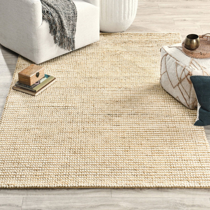 Ivory flatweave rug with tight loop texture and thin tan stripes