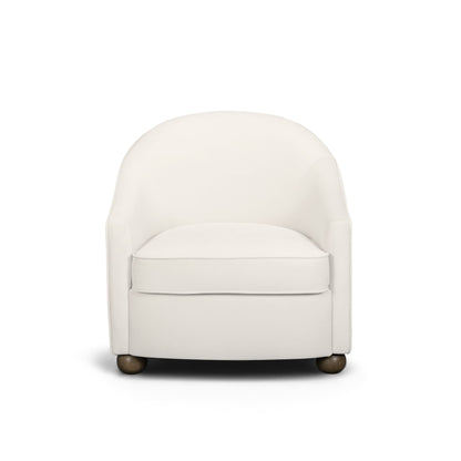 White performance velvet accent chair with rounded arms, boxy seat, and dark legs