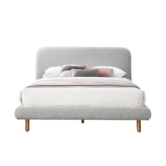 Gray upholstered bed with headboard, slatted base, and fitted bedding set