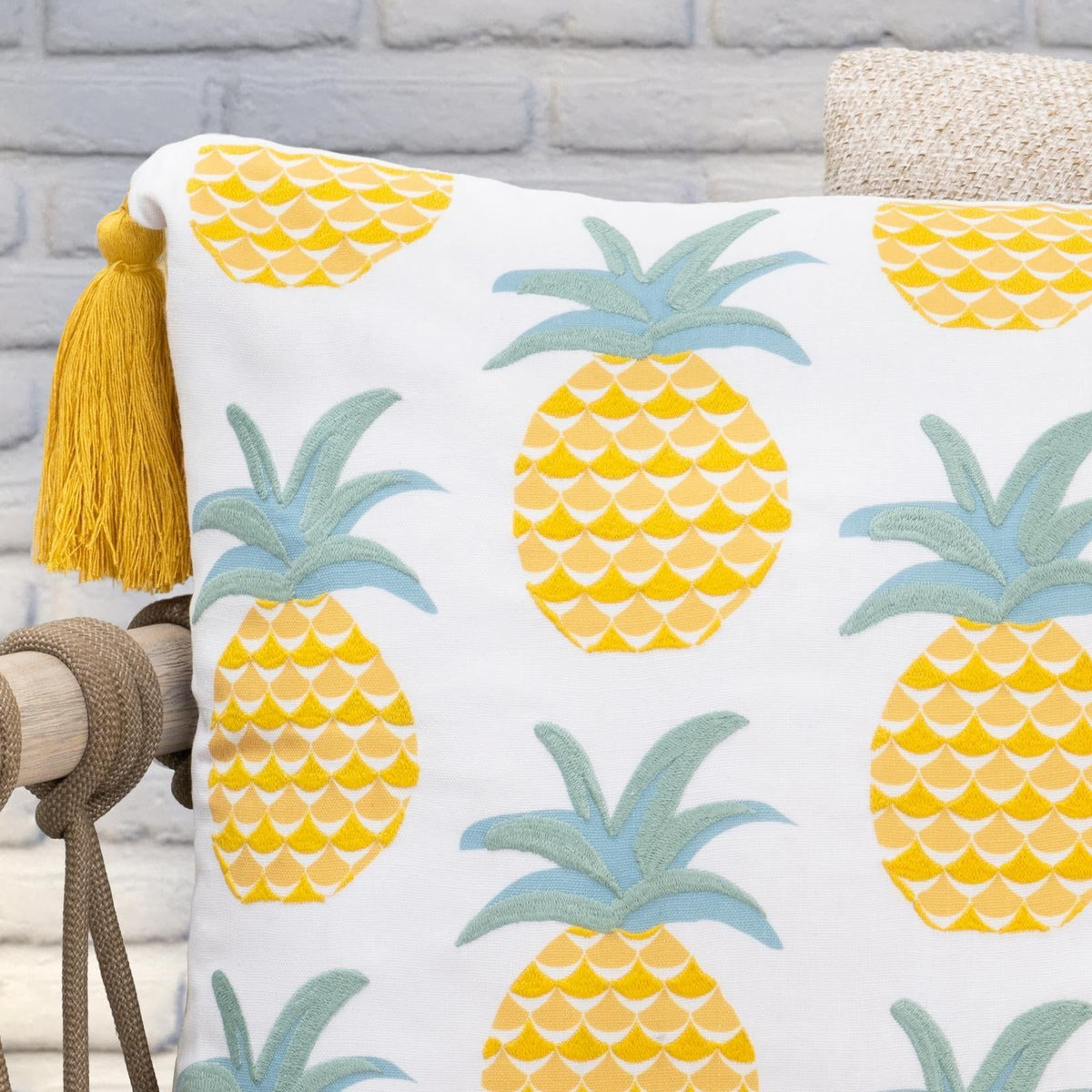 Pineapple throw pillow cover with yellow fruit and teal leaves plus mustard tassel