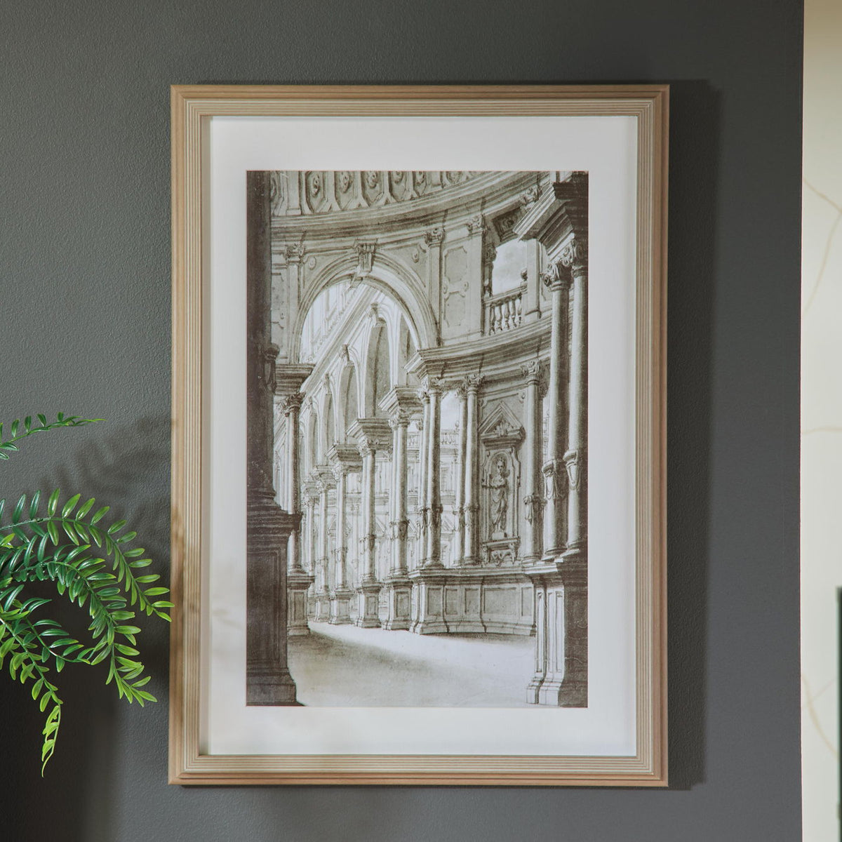 Architectural wall art print in light wood frame, arched corridor black-and-white
