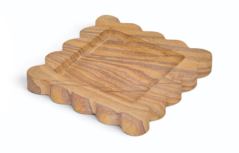 Sandstone wooden serving tray with scalloped edges and striped wood grain