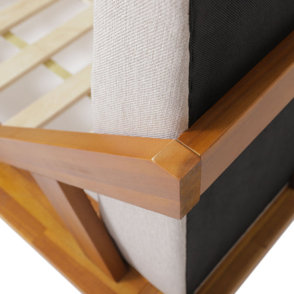 Upholstered bed corner detail with beige and dark fabric panels and acacia wood frame