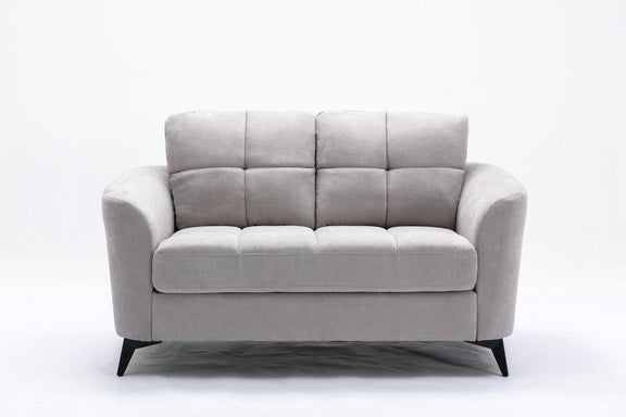 Gray upholstered loveseat with two-seat cushions, tufted back, and black tapered legs