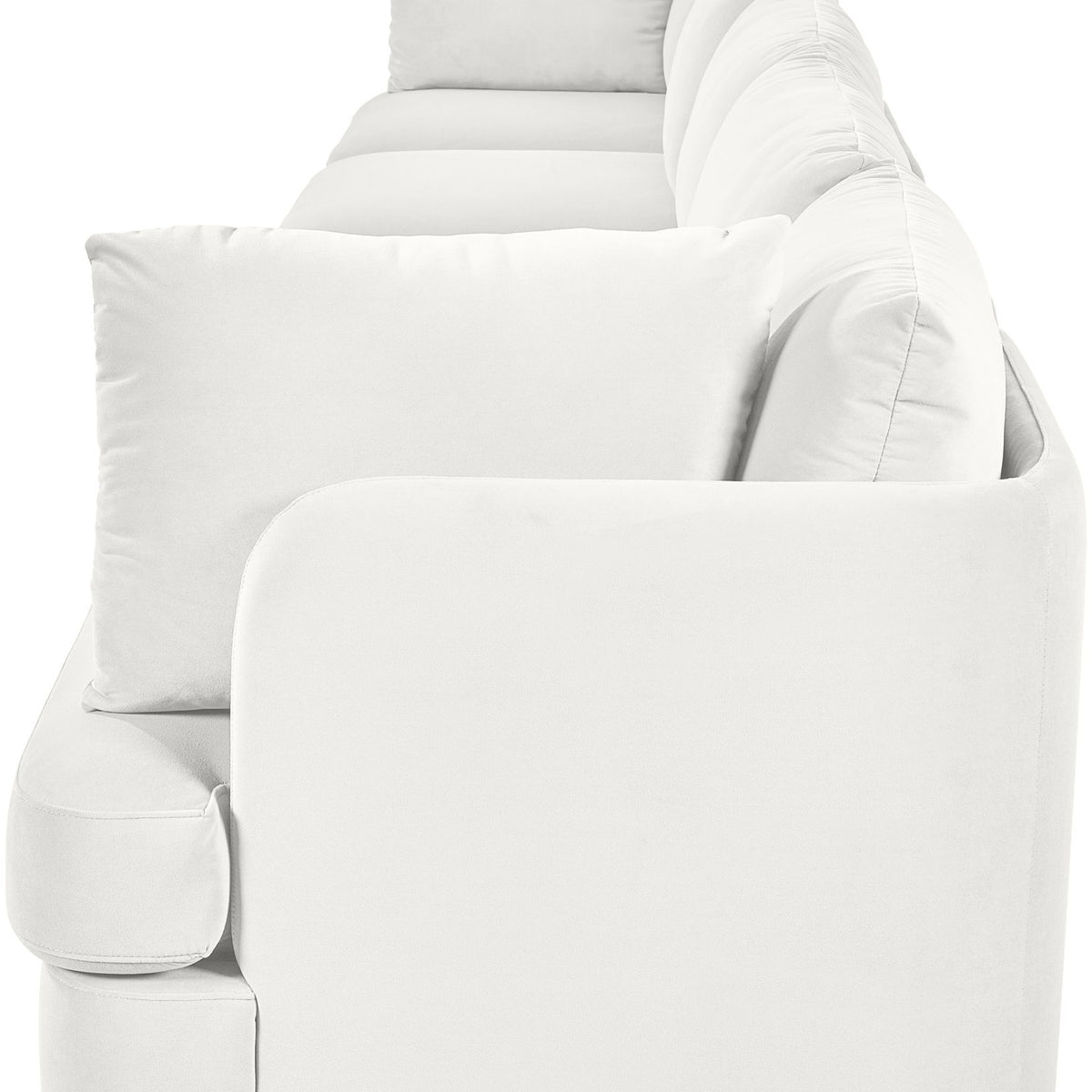White velvet upholstered accent sofa chair with rounded arms and three back pillows