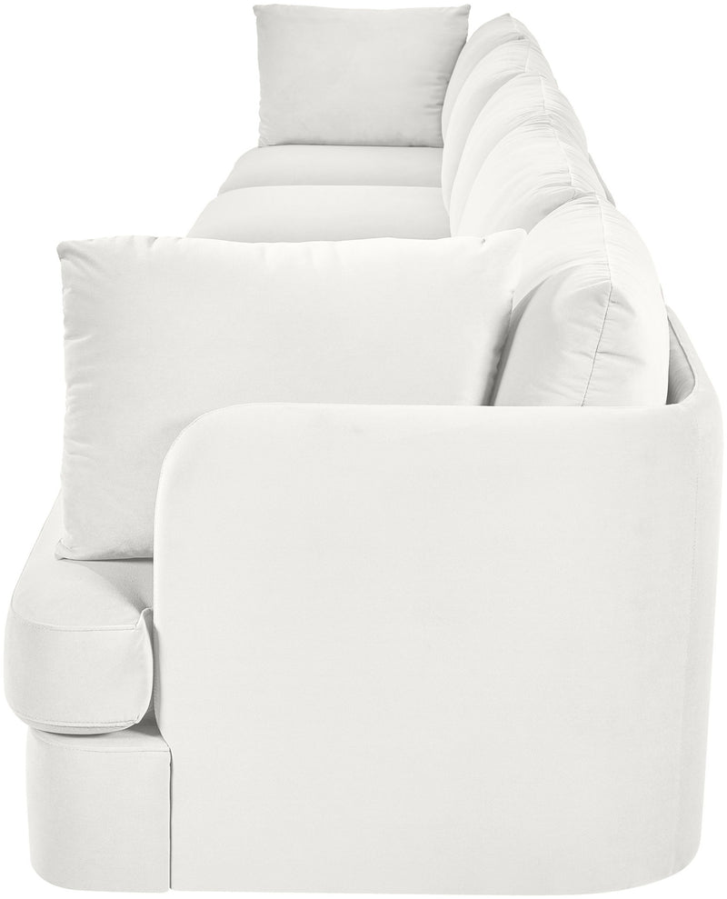 White velvet upholstered accent sofa chair with rounded arms and three back pillows
