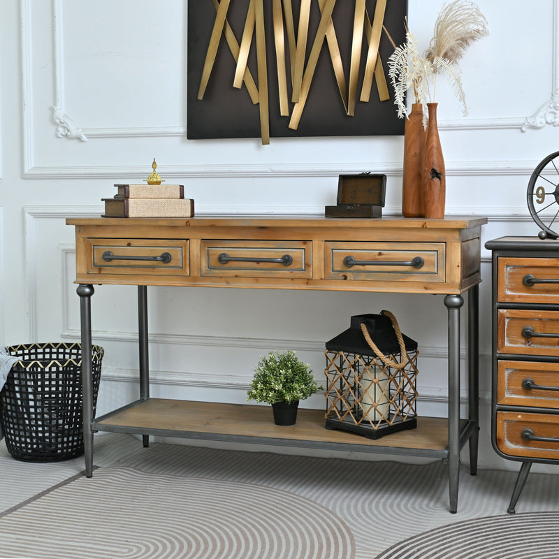 Wood console table with three front drawers and open bottom shelf on dark legs