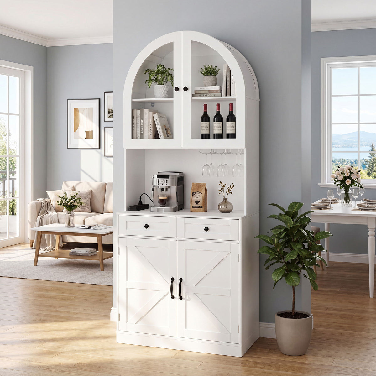 White arched pantry cabinet with open counter, upper shelves, two drawers and lower storage doors