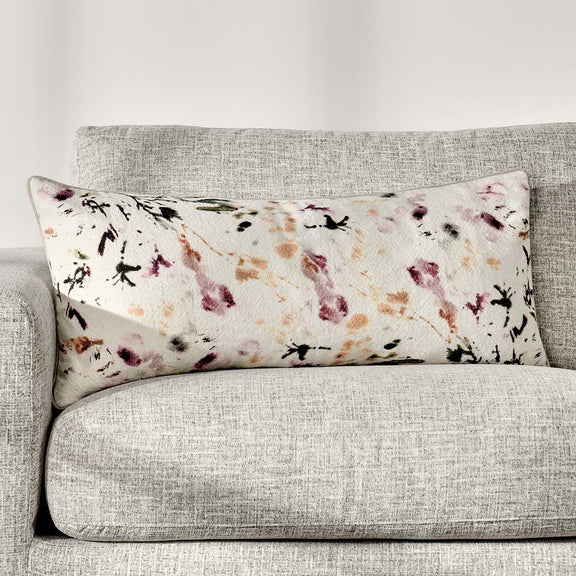 Rectangular printed lumbar pillow with off-white base and purple insect pattern