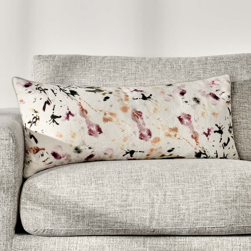 Rectangular printed lumbar pillow with off-white base and purple insect pattern