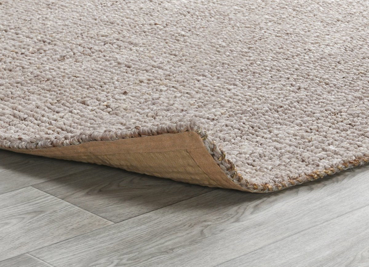 Natural chunky loop rug edge detail with looped pile and visible backing