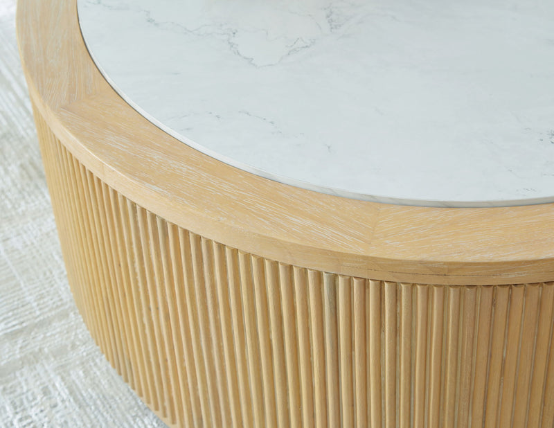 Light brown ribbed side of round cocktail table with white marble edge