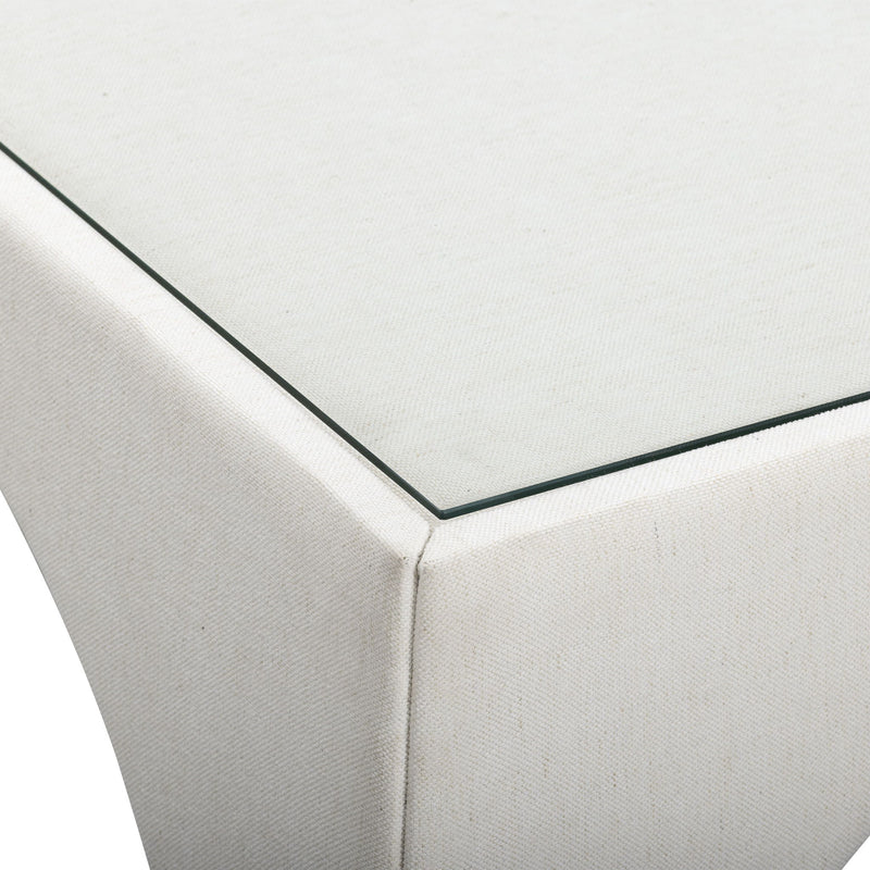 Cream fabric game table corner with stitched seam and black edge trim