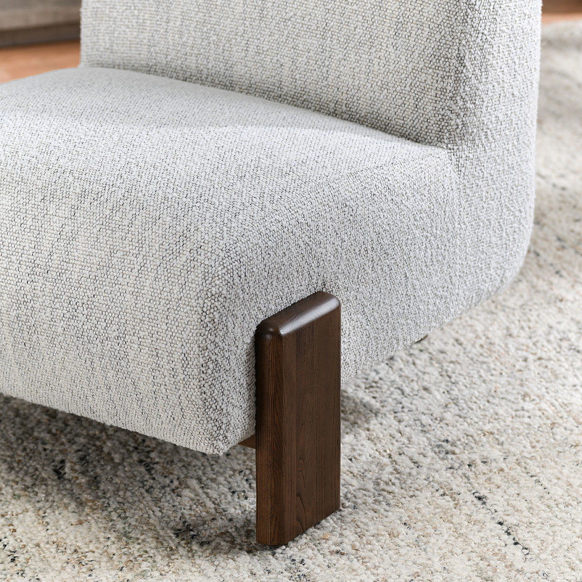 Ivory fabric accent chair arm and dark wood block leg
