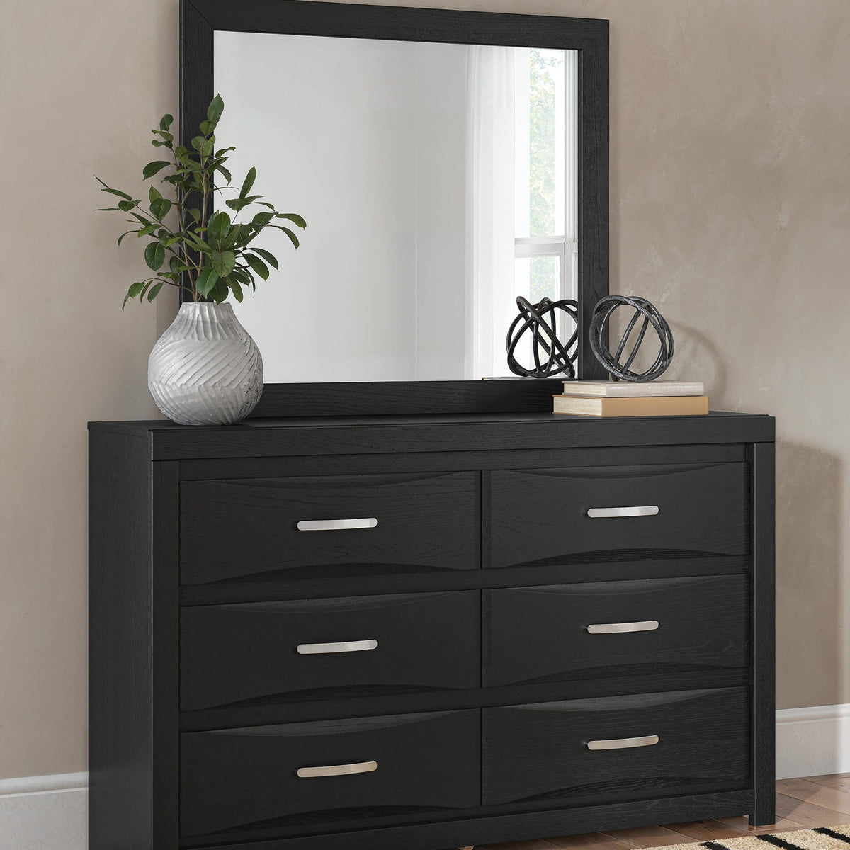 Black six-drawer dresser with square mirror on top and bar pull handles.