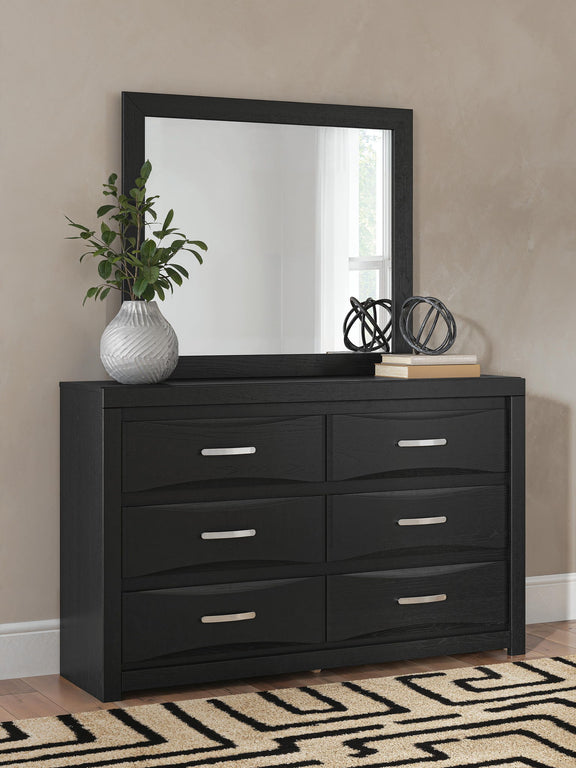 Black six-drawer dresser with square mirror on top and bar pull handles.