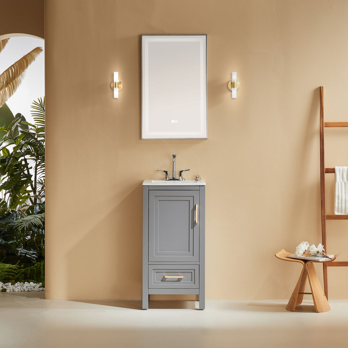 Gray bathroom vanity with white ceramic sink, paneled cabinet door, and lower drawer