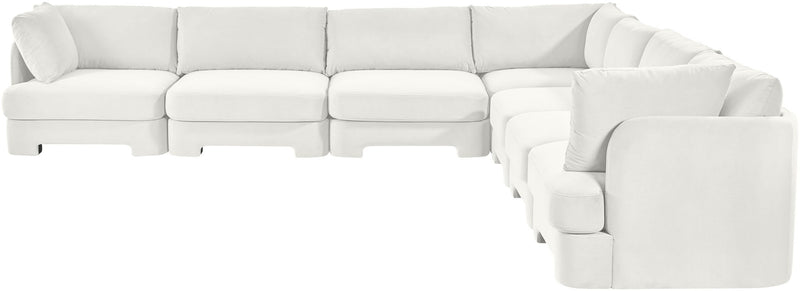 White velvet corner sectional sofa with tufted cushions and right-side chaise arm