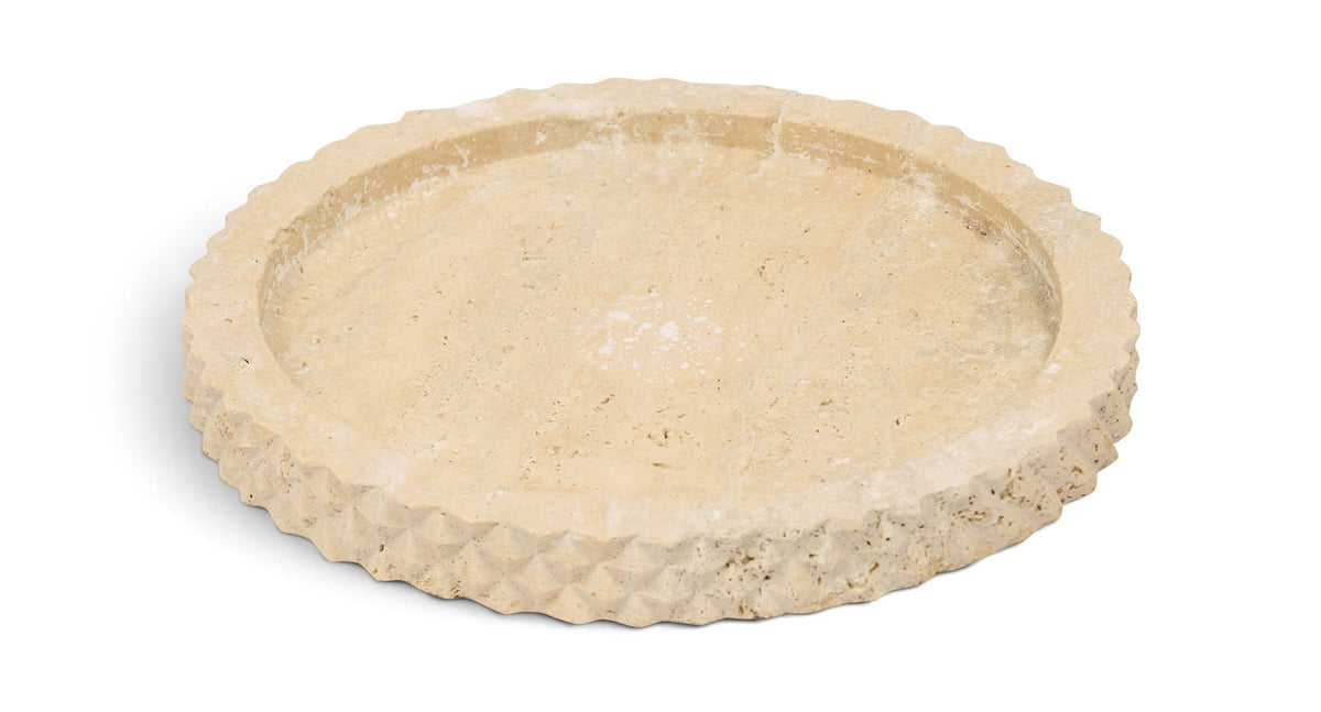 Beige travertine tray with shallow circular basin and scalloped edge, top view.