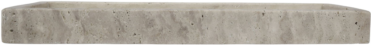 Beige travertine tray side profile with low, thick rim and mottled stone finish