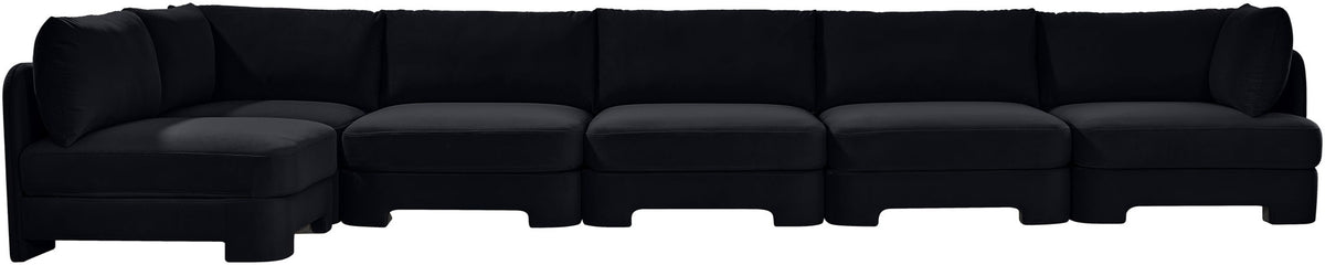 Black armless sectional sofa with tufted seat cushions and low profile