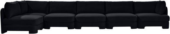 Black armless sectional sofa with tufted seat cushions and low profile