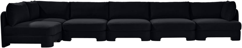 Black armless sectional sofa with tufted seat cushions and low profile
