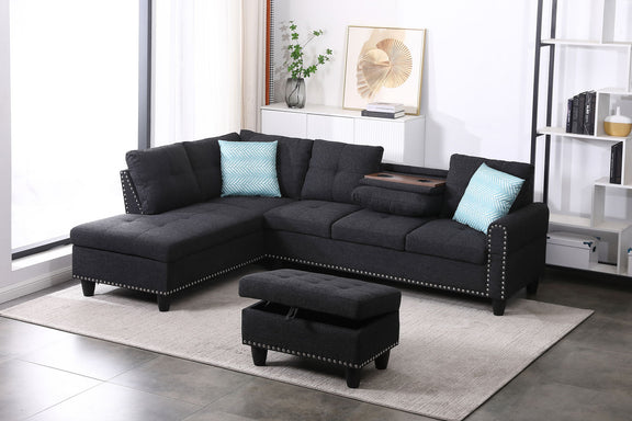 Dark gray sectional sofa with left-facing chaise and ottoman, tufted cushions and blue pillows