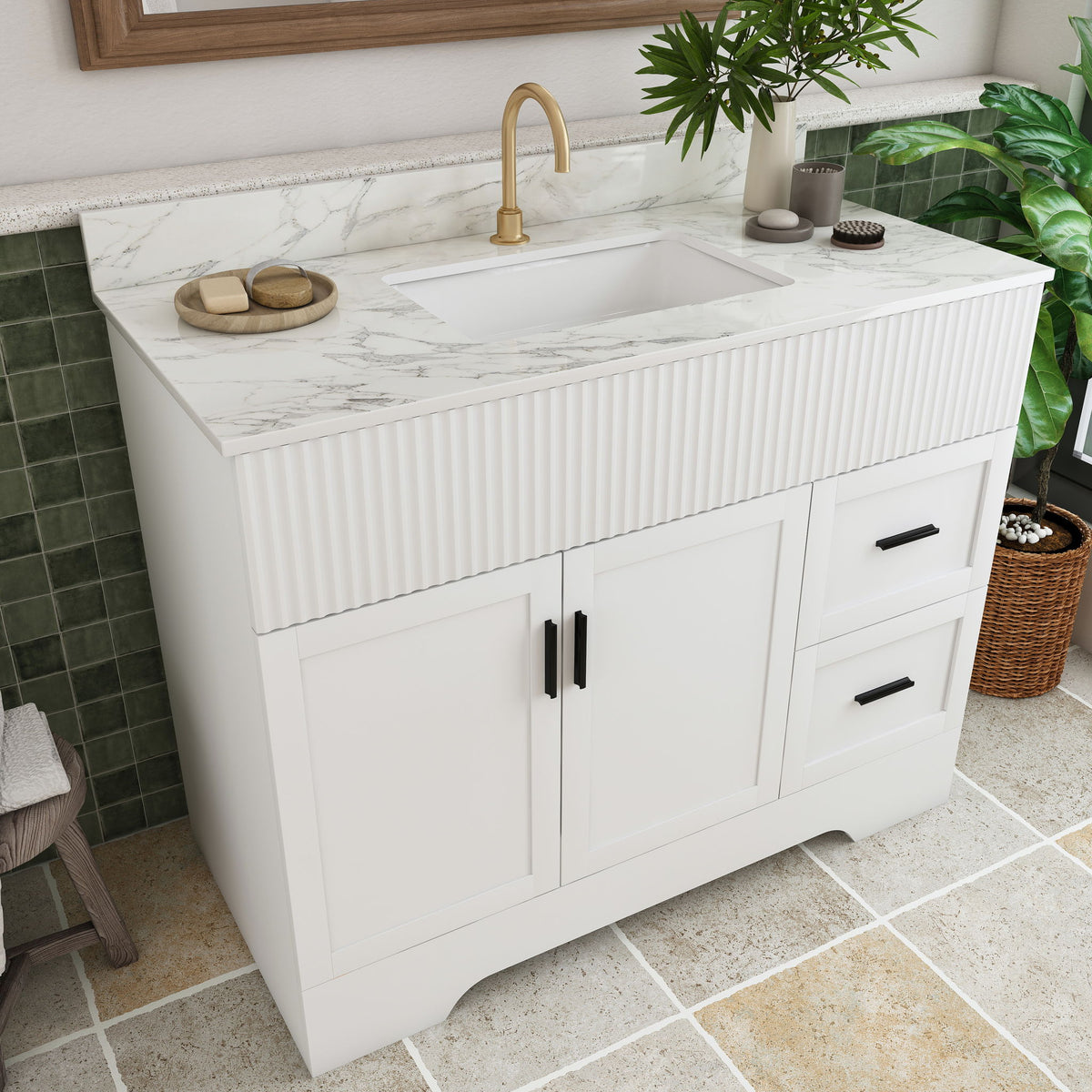 White bathroom vanity with fluted front, single sink and gold faucet, two doors, drawer